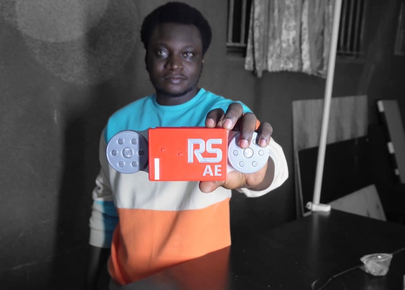 Ahmed holding Finished Logger