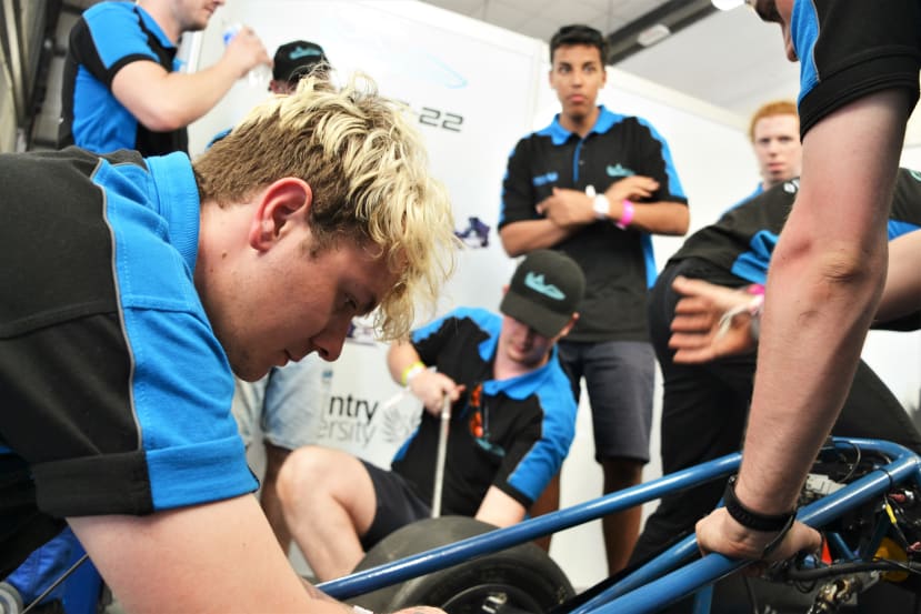 Students working on the car