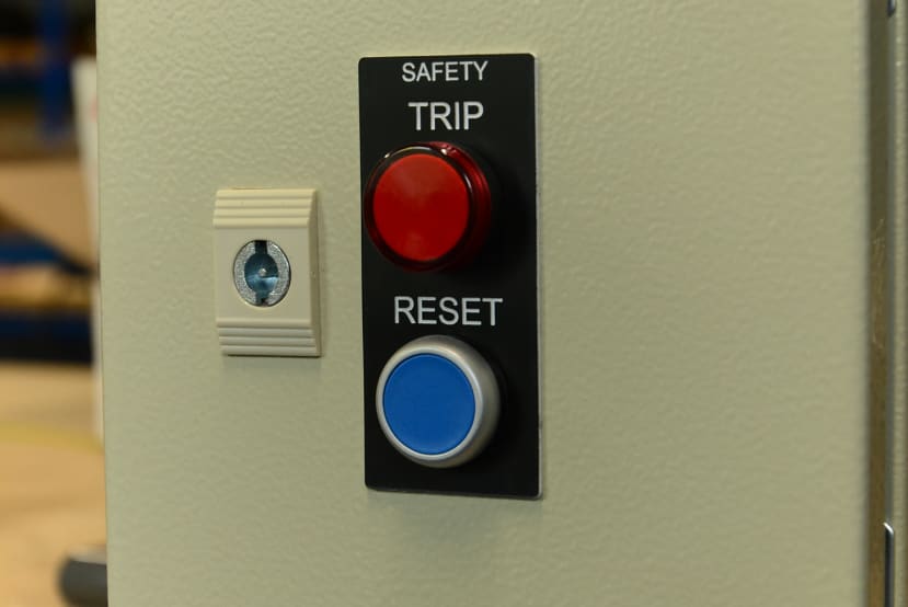 Door panel with safety trip