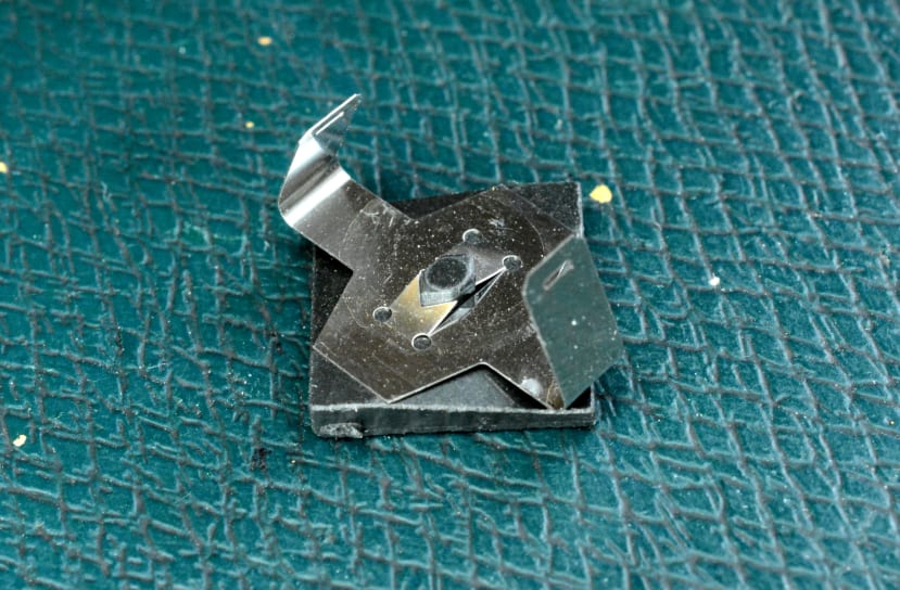 fly plate attaches to the beam spring at each end