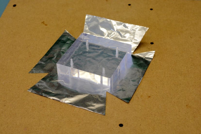 Next the scintillator was wrapped in foil, so as to further reflect light