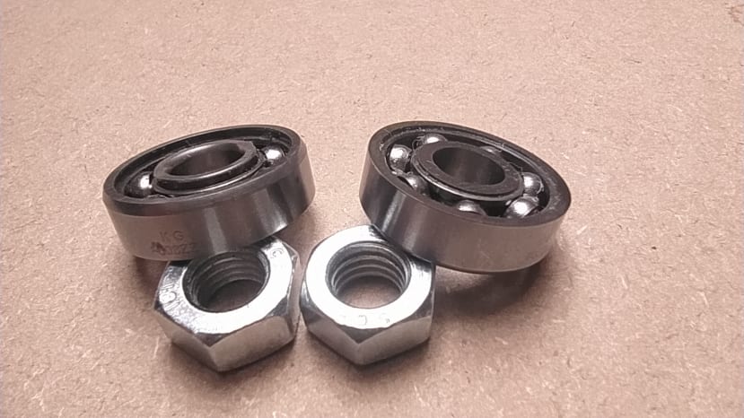 skateboard bearings with securing nuts