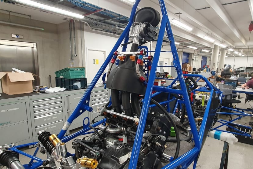 Car frame with engine fitted