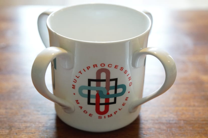 A four handled promotional mug marketing the T9000 transputer.