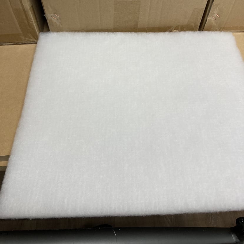 A new fibreglass wool filter. It is bright white in colour.