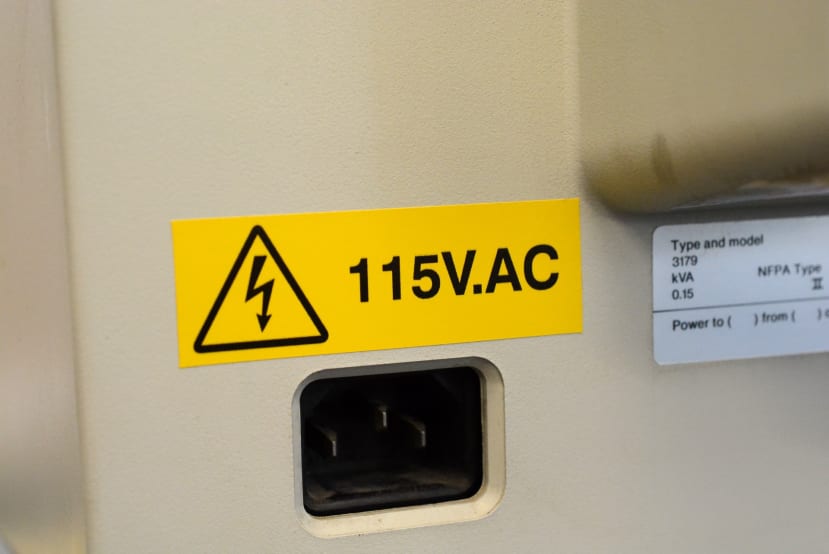 A Warning Sticker placed on input for 115V use