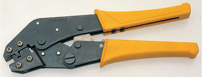 Ratchet crimp tool for flag receptacle