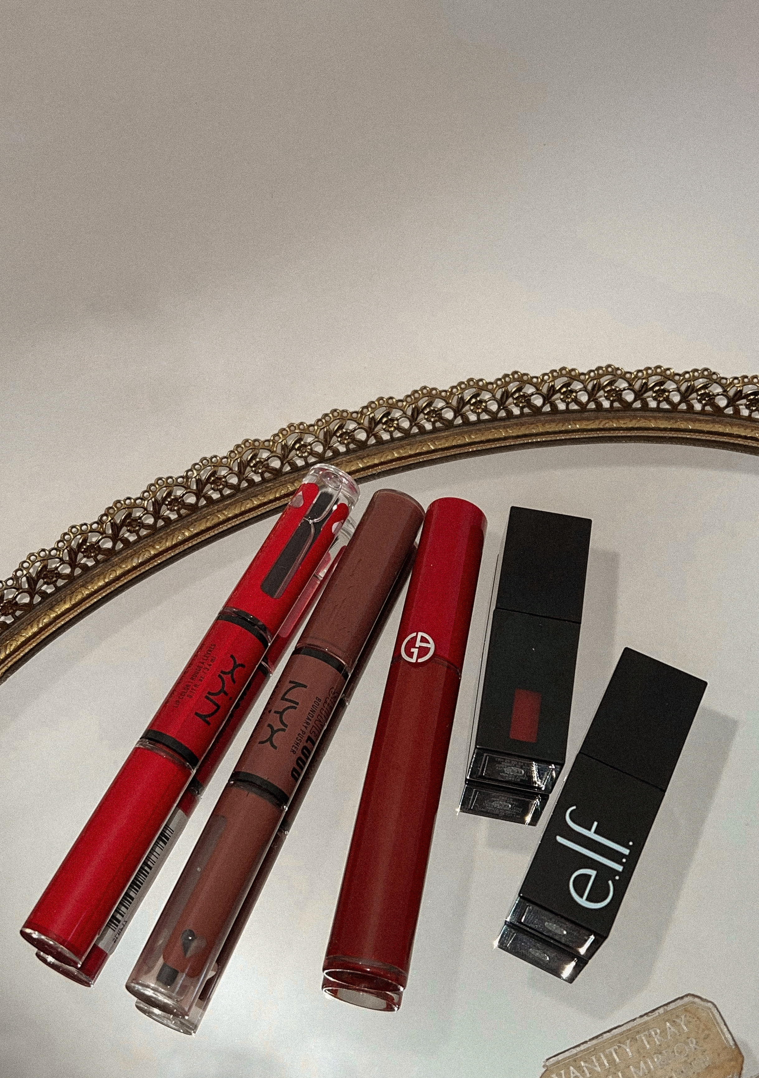 lip products: nyx liquid lipsticks, elf gloss stains, armani li pmaestro