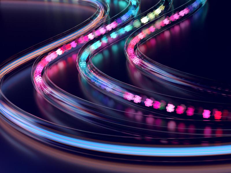 Abstract image of smooth, curved light trails in pink, blue, and purple tones forming a flowing path