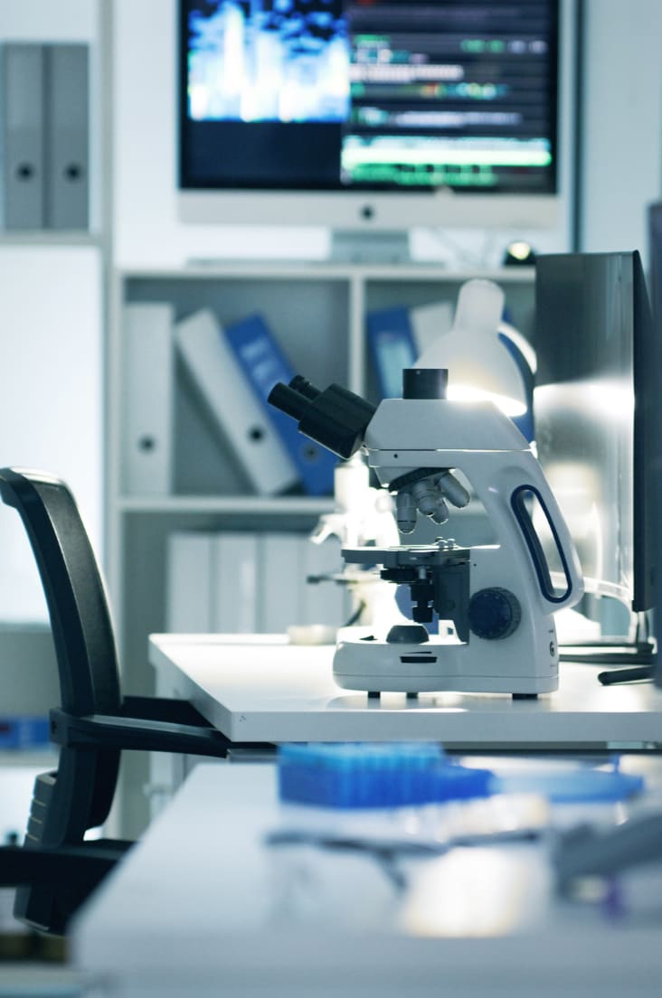 Inside of a laboratory with a microscope on a table