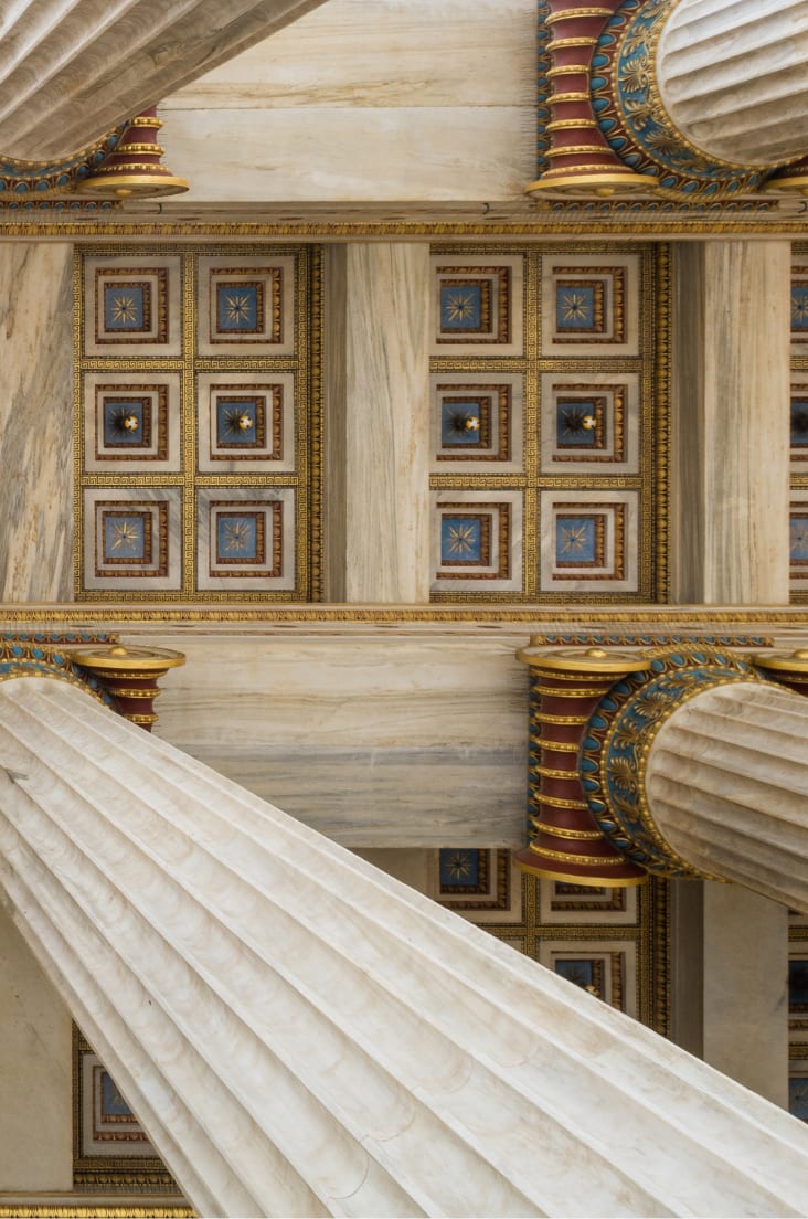 The ceiling of a building with columns