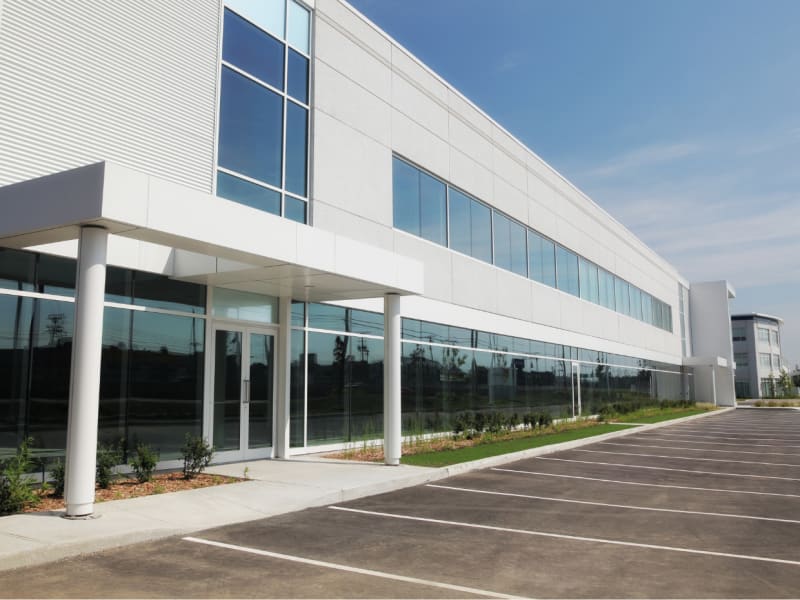 Parking lot in front of a corporate building