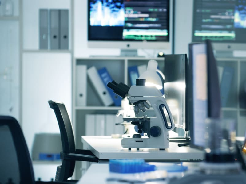 Inside of a laboratory with a microscope on a table
