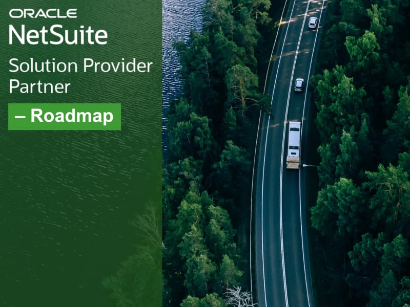 Aerial view of cars traveling alongside the forest road