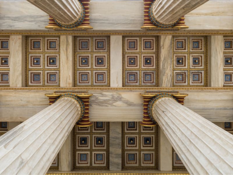The ceiling of a building with columns