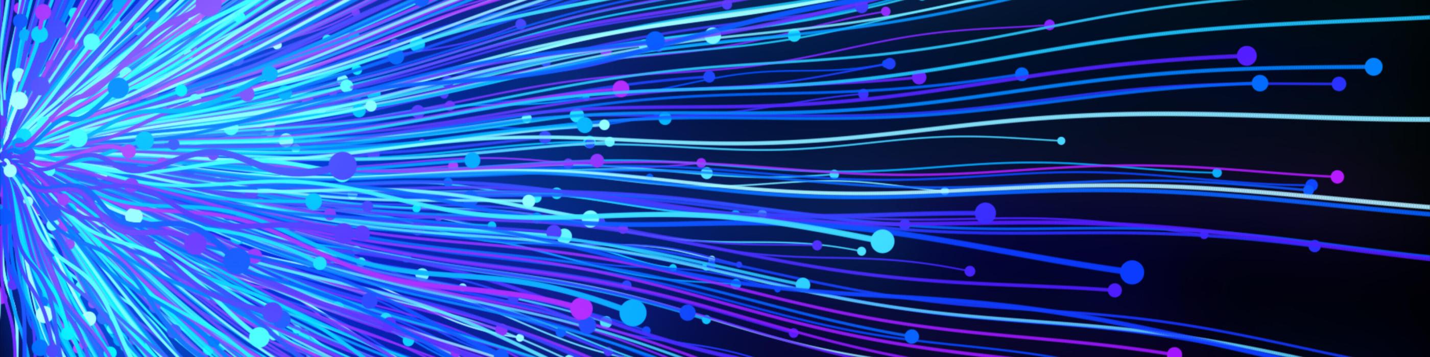 Abstract image of blue and purple light streaks radiating outward with small glowing particles