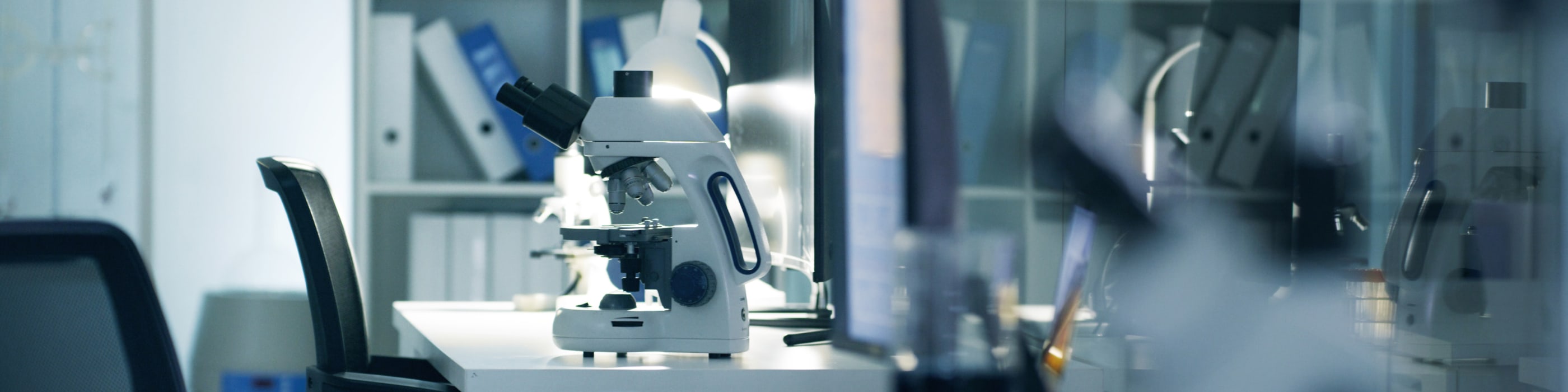 Inside of a laboratory with a microscope on a table