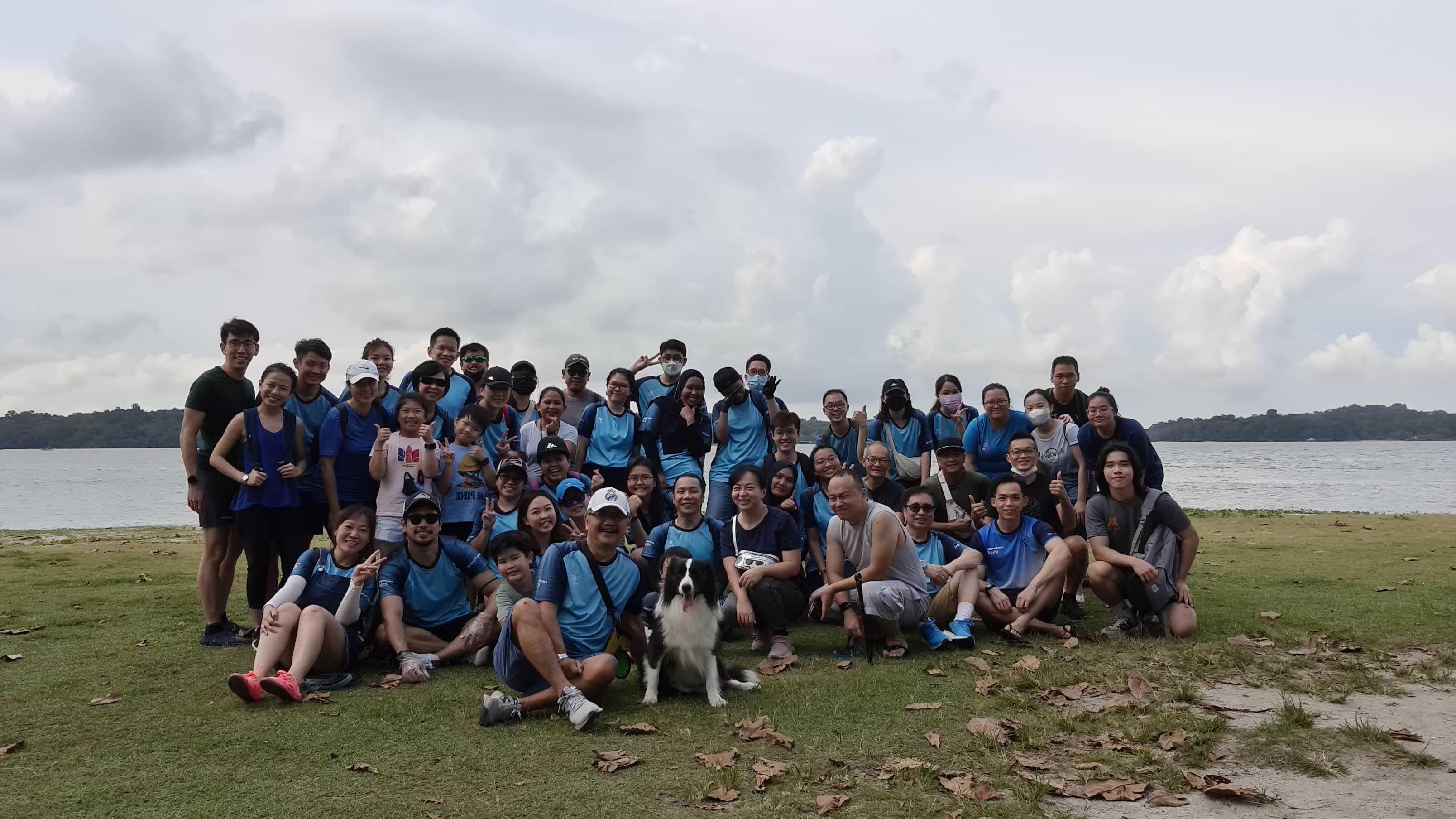 RSM Singpaore's eco volunteers taking a group photo in front of Changi Beach after cleaning up the Changi beach. 