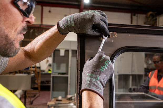 Image of a persons hands with gloves on