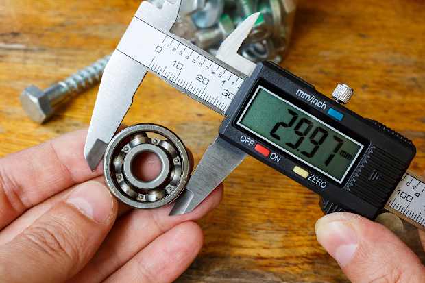 Person measuring a bearing