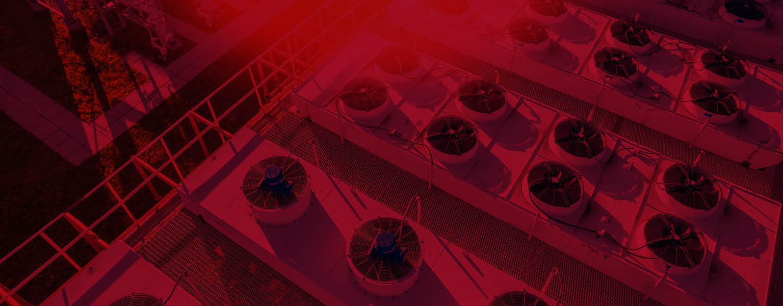 A rooftop with industrial HVAC units on top