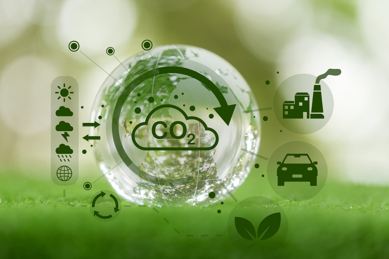 A graphic of earth, surrounded by examples of causes of CO₂ emissions