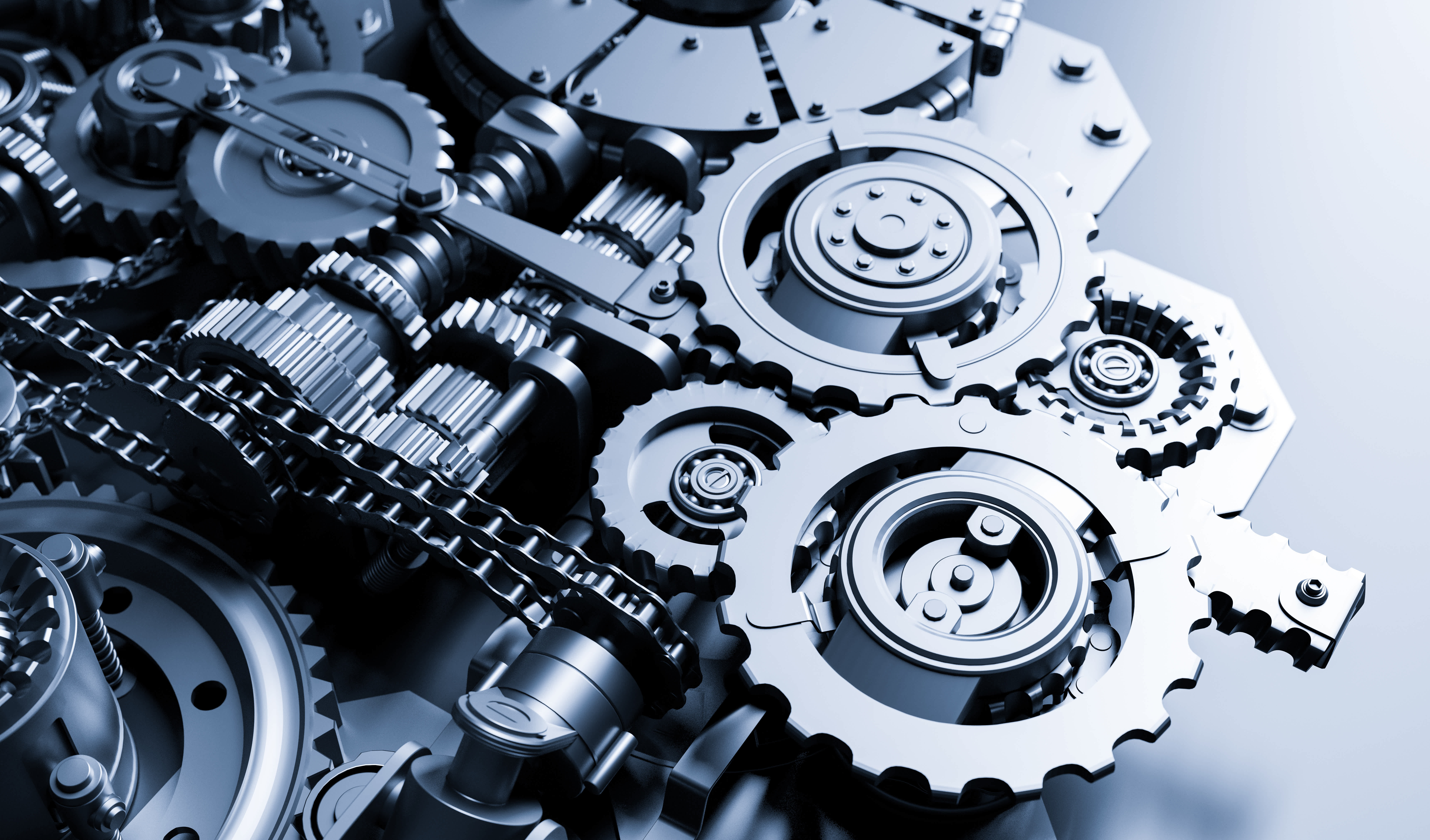 Interlocking steel gears and mechanical components representing precision engineering and industrial manufacturing.