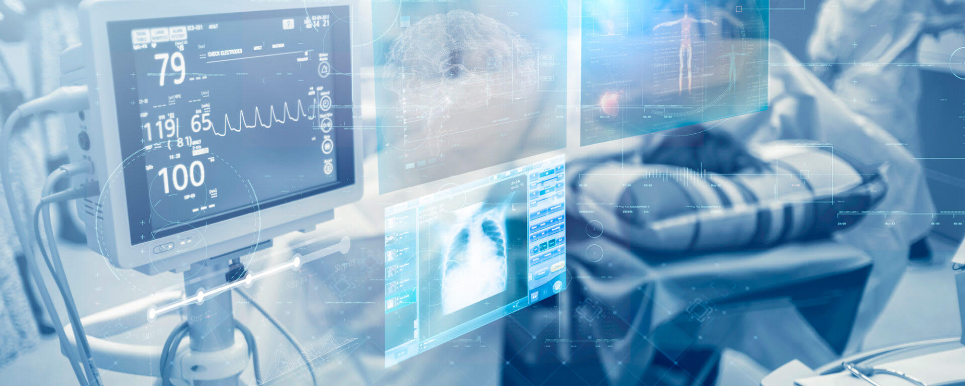 A close up of medical systems displaying an x-ray and vitals.