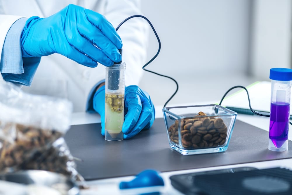 a scientist measures pH using a pH meter