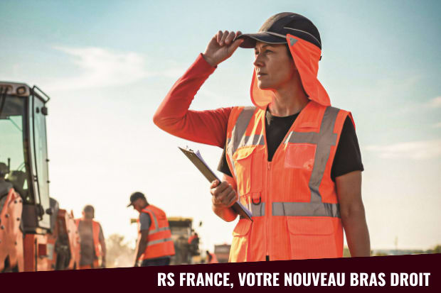 Jeune femme avec une casquette et des vêtements haute visibilité