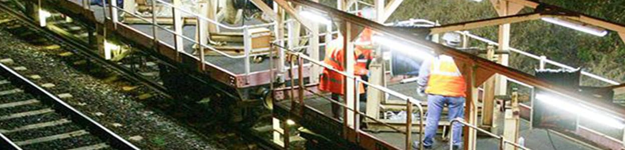 workers doing maintenance on a railway track