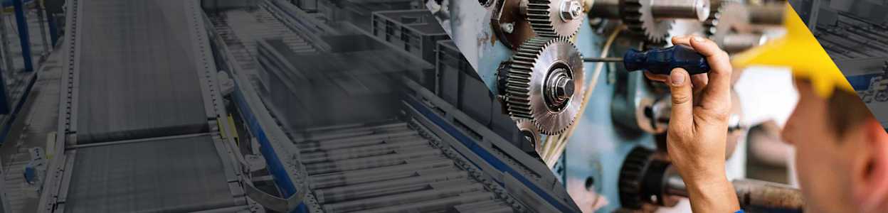 An engineer with a screwdriver in a machine, with a conveyer belt down the left hand side