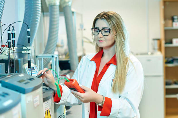 RS lab technician taking measurements