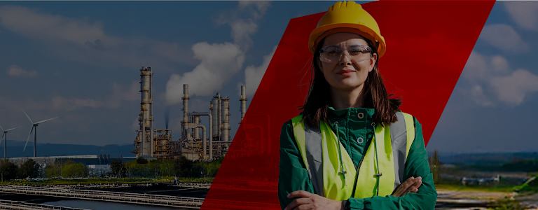 Woman wearing a safety helmet and vest