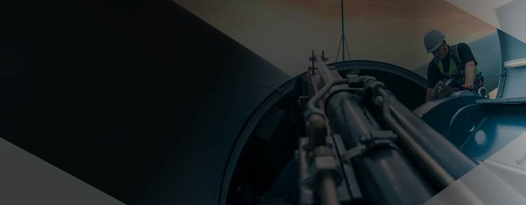 Image of a man maintaining a wind turbine