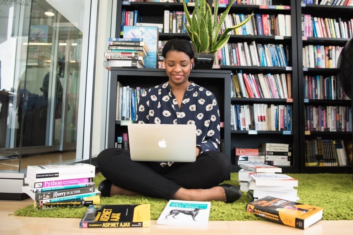 woman researching podcast topic ideas