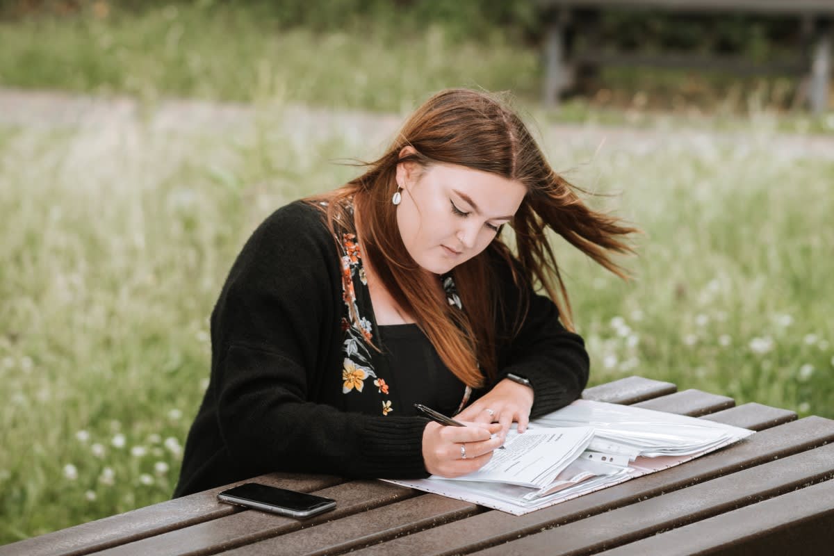 woman organizing tax deductions for her podcast