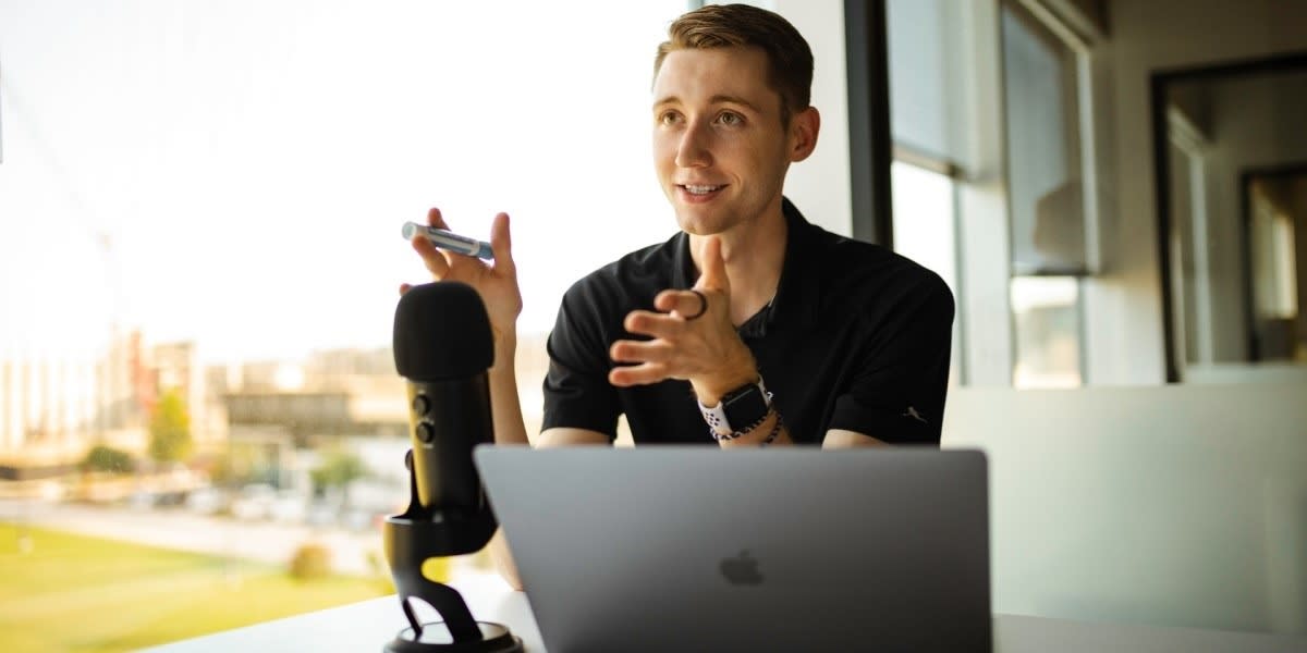 man having podcast