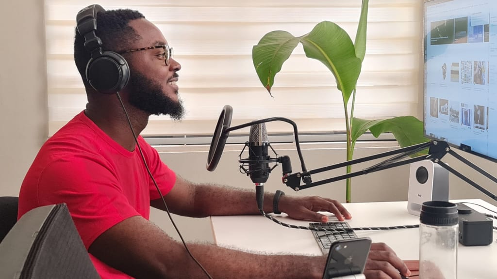 man working on his podcast