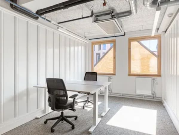 Bright workspace with modern furnishings, natural light, and a minimalist design on Sahar Road.