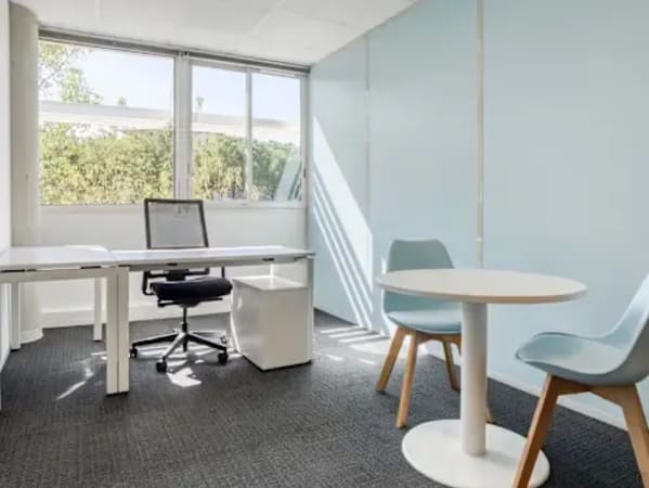 Bright and modern workspace with natural light and stylish seating in Downtown Dubai.