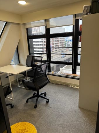 Bright coworking space in Sheung Wan with ample natural light and ergonomic seating.