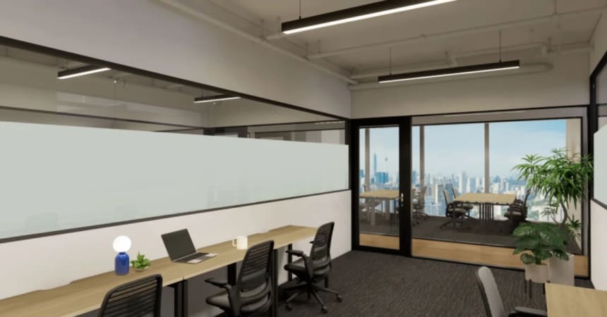 Modern coworking space with sleek desks, ergonomic chairs, and city views. Perfect for productivity.