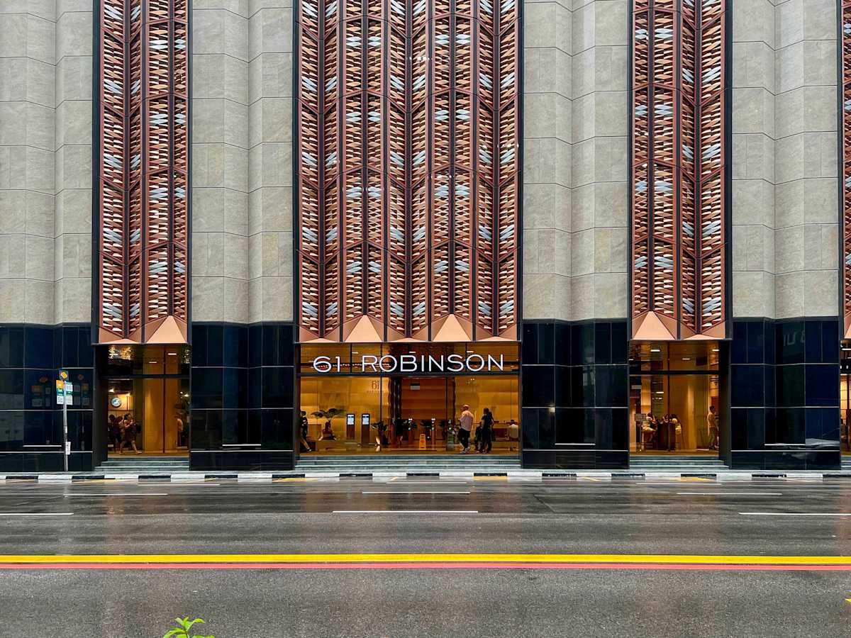 Flexible coworking space at 61 Robinson Road, featuring a modern facade and prime location.