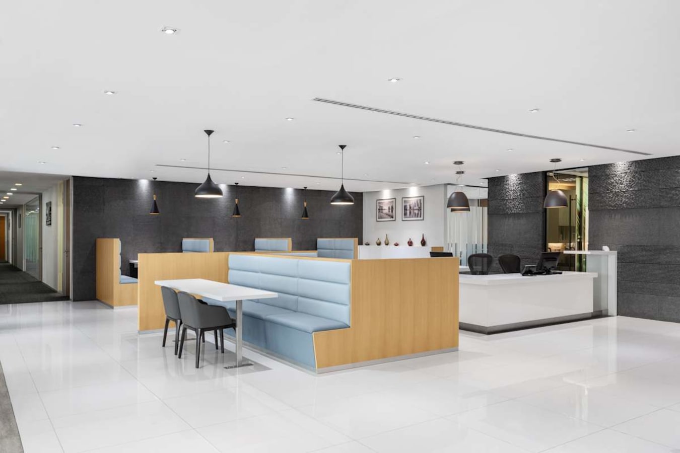 Modern coworking space with sleek design, ample lighting, and comfortable seating on Fullerton Rd.