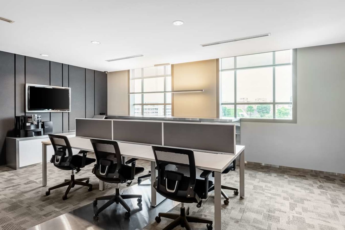 Modern coworking space with ergonomic chairs, natural light, and collaborative desks in Tampines.