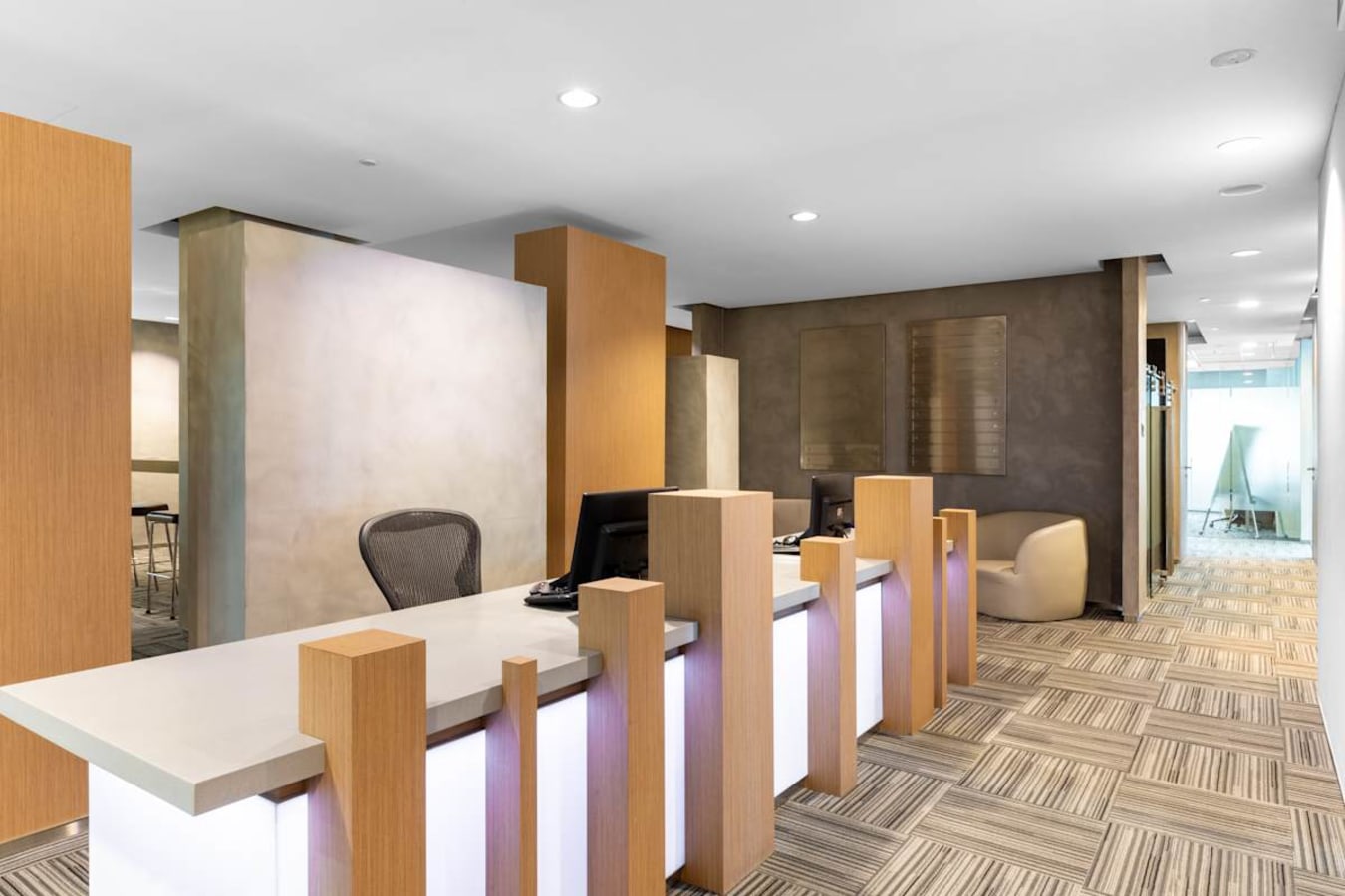 Modern coworking space on Orchard Road featuring sleek desks, warm lighting, and stylish decor.