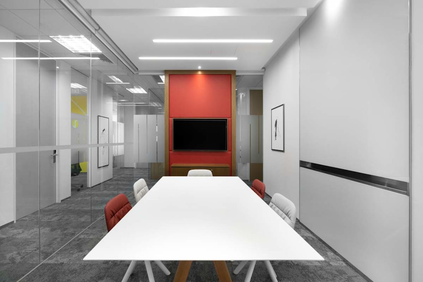 Modern coworking space with sleek design, meeting room, and vibrant decor in Venture Drive.