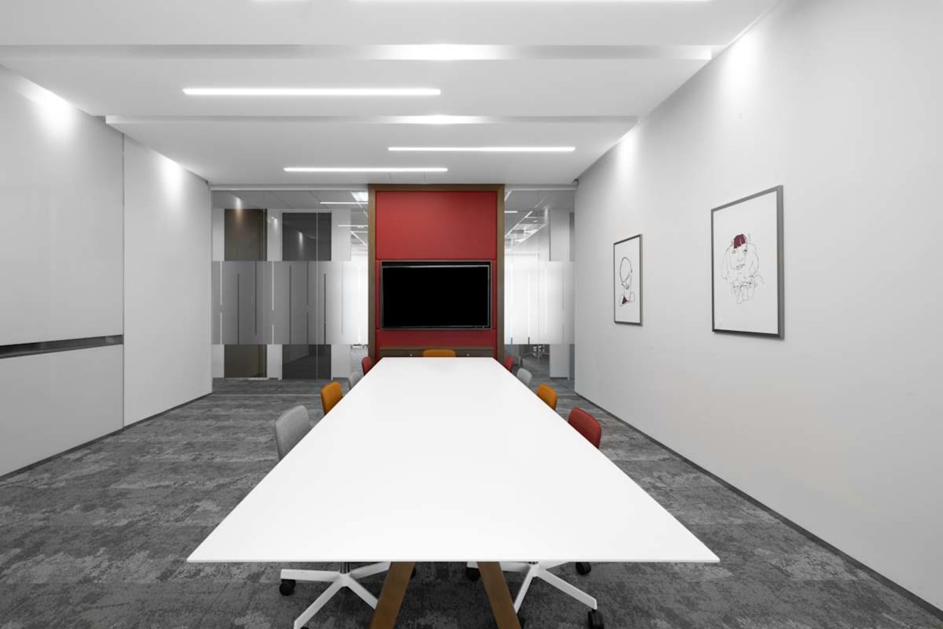 Sleek meeting room with modern design and ample seating in Venture Drive coworking space.