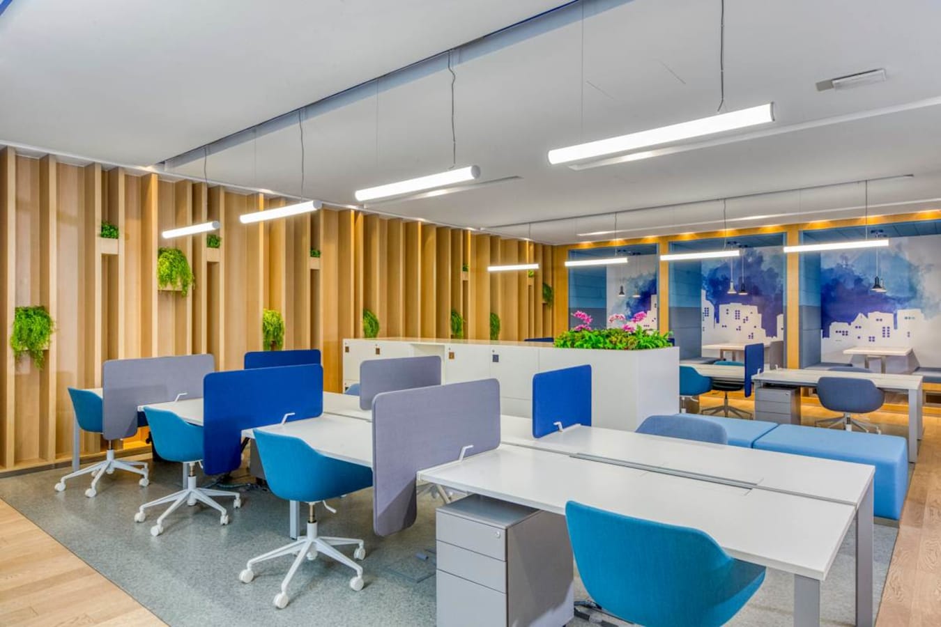 Modern coworking space with vibrant accents, ergonomic chairs, and ample natural light.